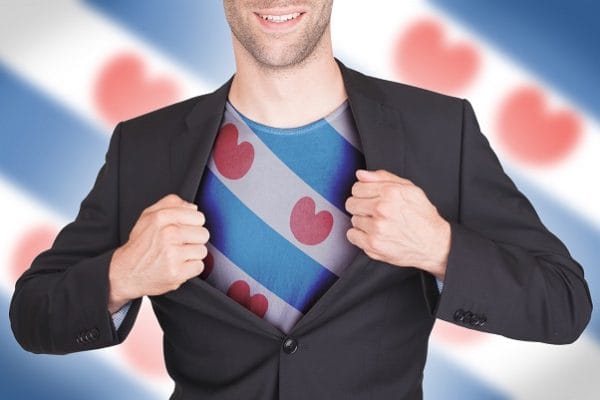 Businessman opening suit to reveal shirt with flag