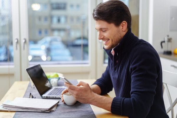 Attractive business man working from home
