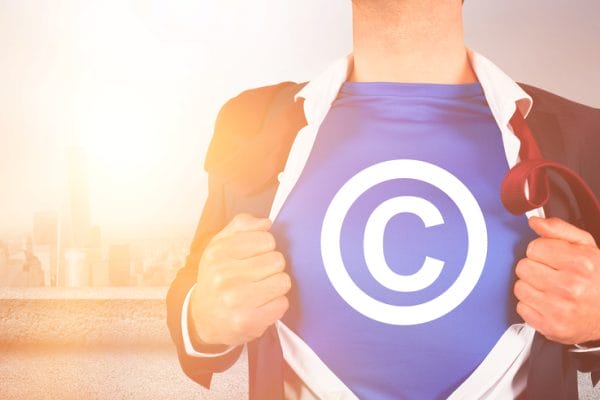 Businessman opening shirt in superhero style against One World Trade Center