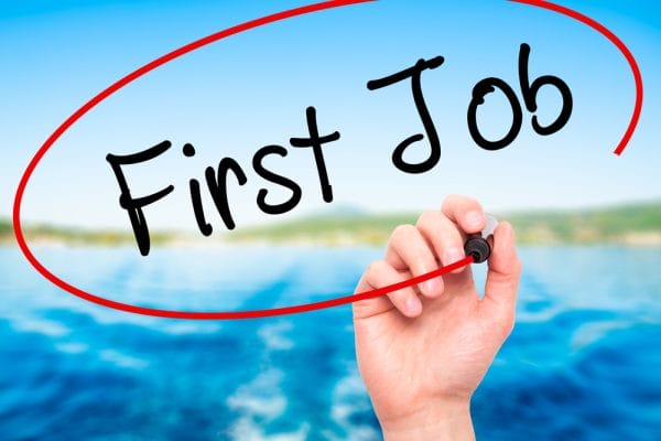 Man Hand writing First Job with black marker on visual screen. Isolated on nature. Business, technology, internet concept. Stock Photo