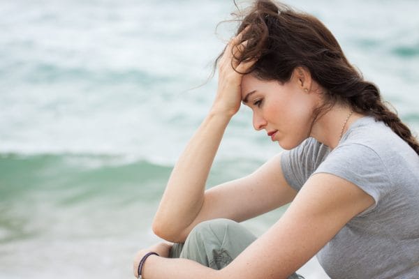 Sad and upset woman deep in thought