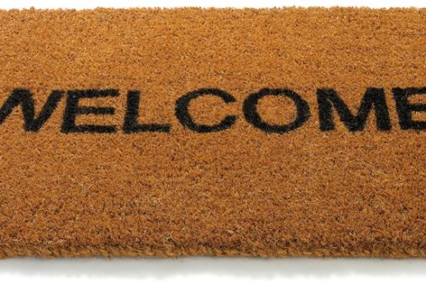 Welcome front door mat isolated on a white background