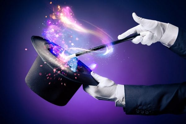 High contrast image of magician hand with magic wand