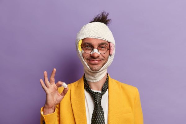 close-up-injured-man-with-dark-bruise-eyes-brain-concussion-wears-bandage